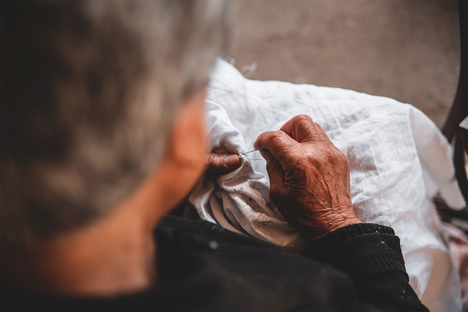 Closeup of someone doing embroidery.