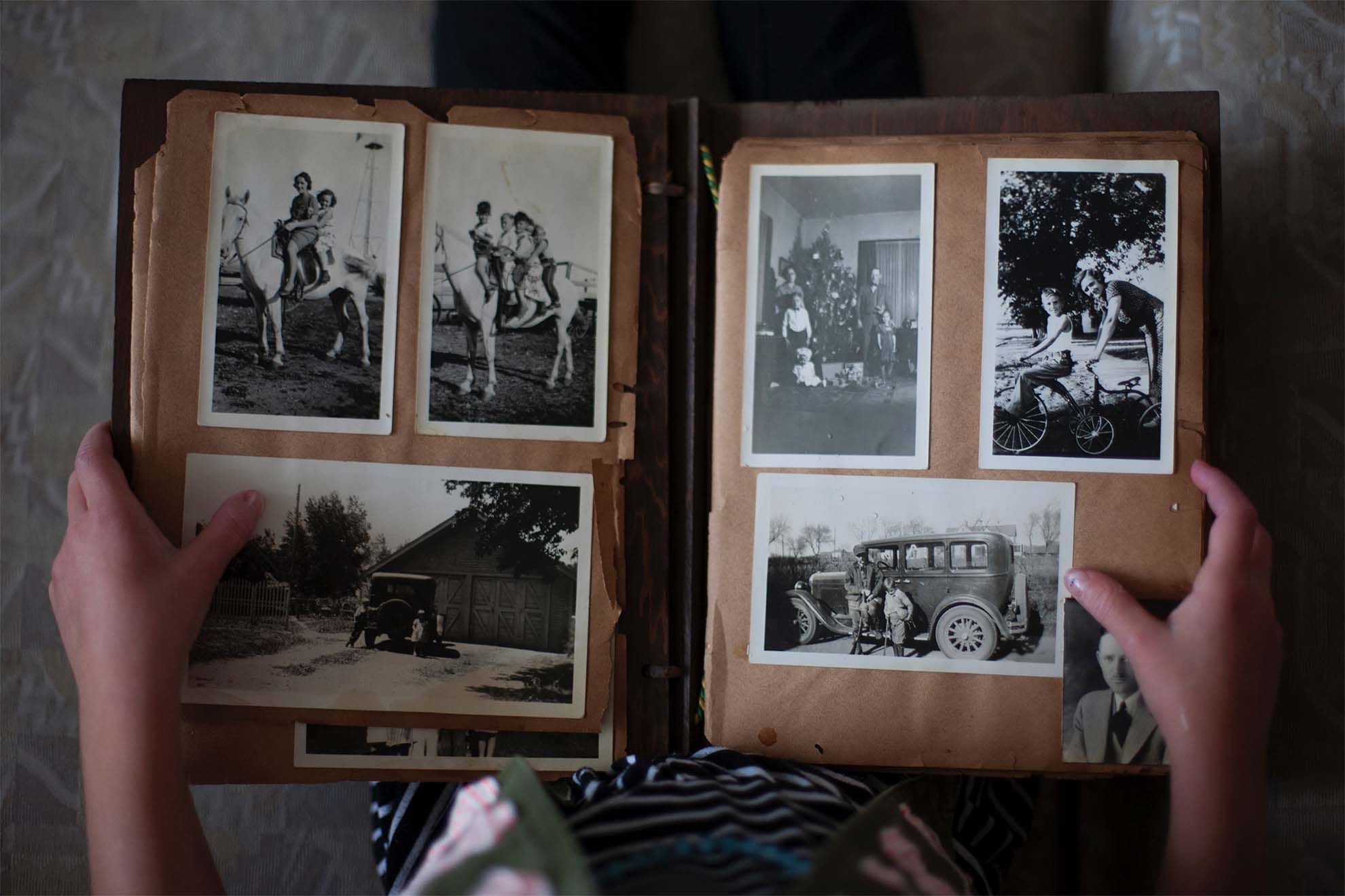 Selection of black and white photos in a photo album.